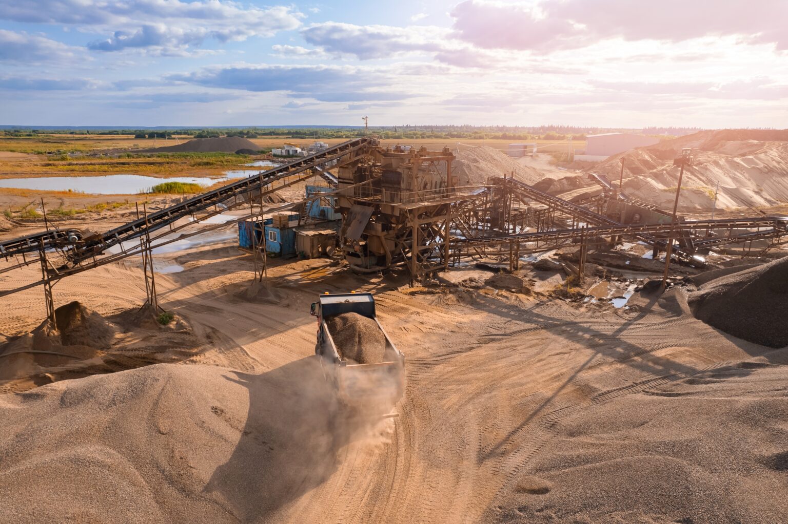 Mining,Conveyor,,Excavator,And,Truck,Working,In,Sand,Opencast,,Aerial